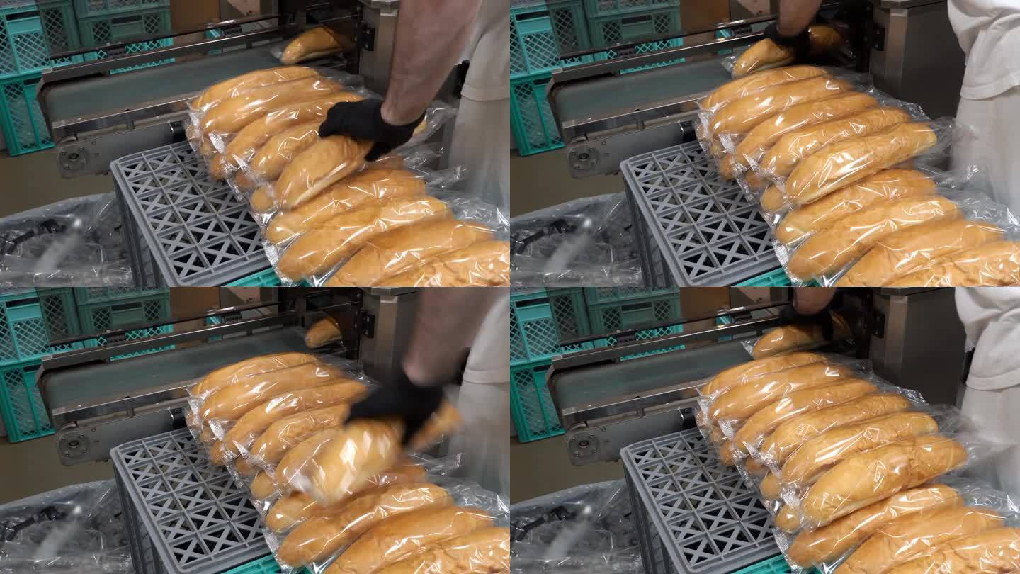 面包厂用透明包装薄膜包裹新鲜面包的包装线