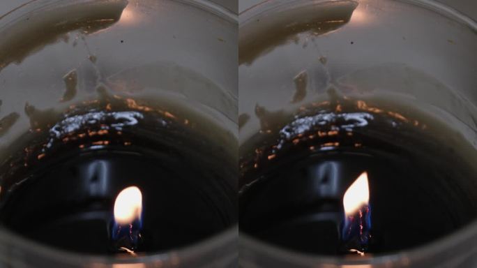 剪下香氛蜡烛，女人在家里做蜡烛，女性的手从锅里倒黄色的液体蜡到硅模里