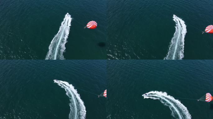 无人机鸟瞰图，乘坐滑翔伞快艇起飞。