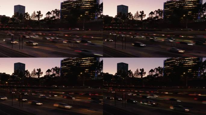 洛杉矶市中心的日落到夜间高峰时间交通在110高速公路上延时拍摄美国加利福尼亚州