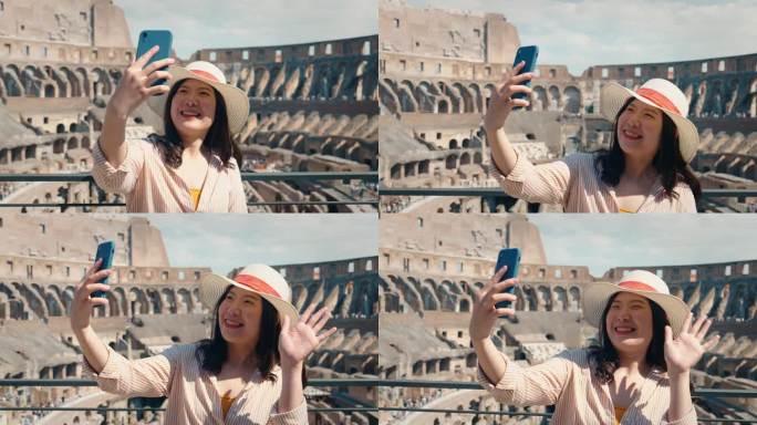 意大利罗马，夏天，亚洲女性游客观光景点的后景，用手机自拍视频快乐地打电话，环顾四周