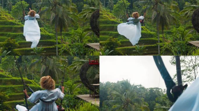 美丽的女人在巴厘岛的tegalalang梯田荡秋千。