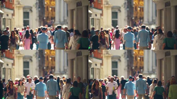 阳光明媚的时候，意大利威尼斯市拥挤的游客在散步和购物