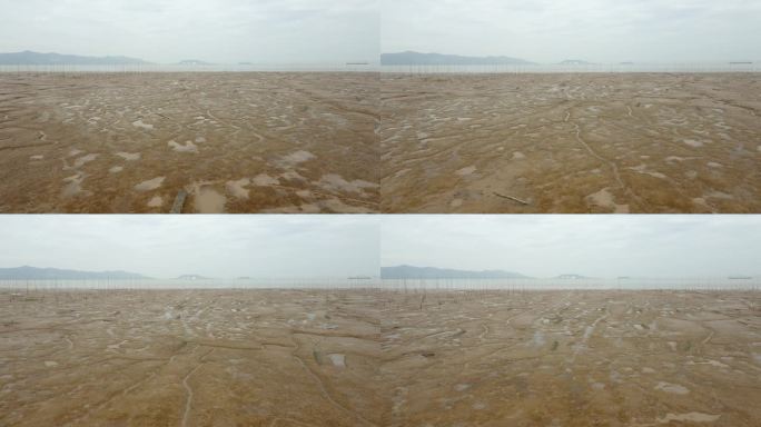 无人机拍摄的南中国海沿岸潮间带泥滩在一个多云雾天，中国