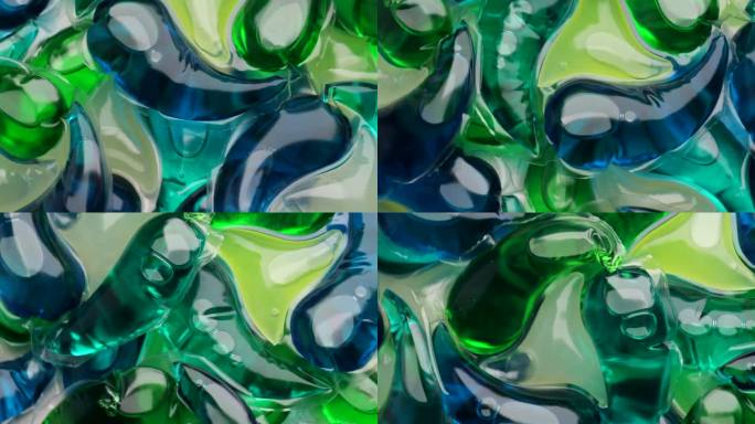 用洗衣液洗涤凝胶胶囊，旋转一圈。蓝绿色液体洗衣粉的全画幅镜头。