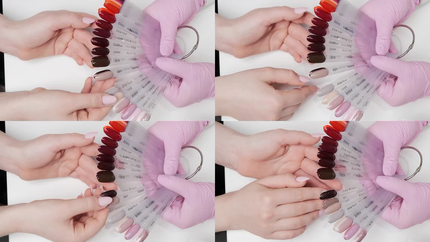 客户在美容院使用凝胶指甲油时选择的颜色。俯视图，近景，手持。