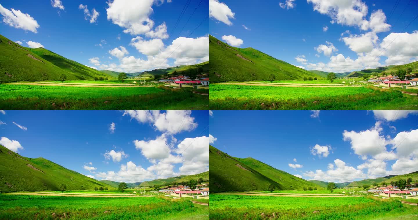 延时摄影蓝天白云下的山脚村庄