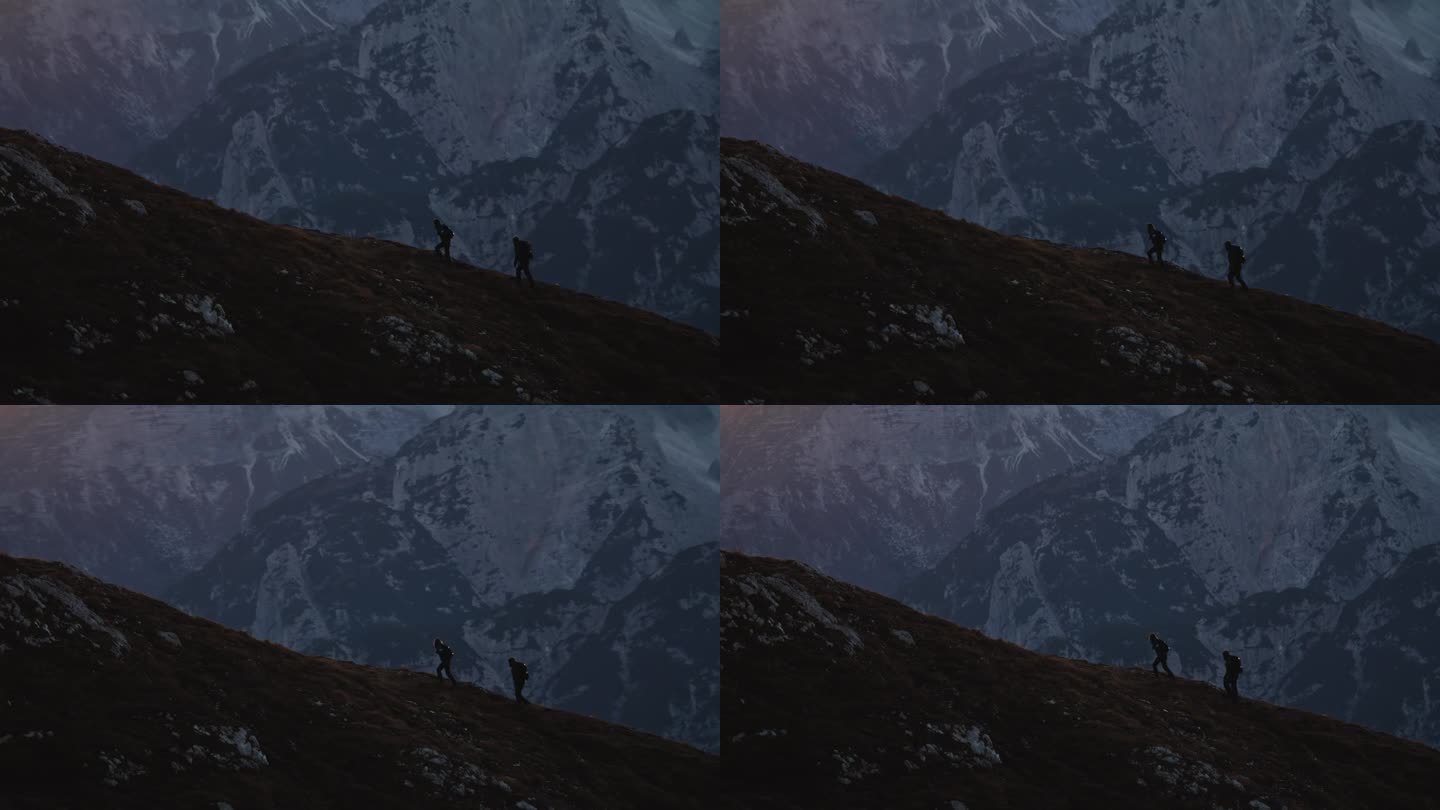 SLO MO剪影攀登:夫妇在黄昏的雄伟攀登