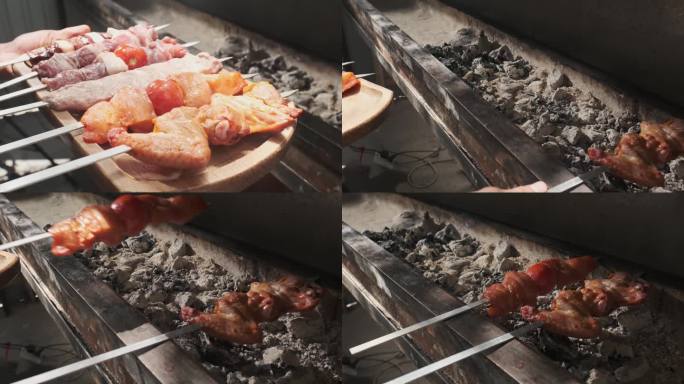 烤肉师傅把鸡肉、肉、肝和蔬菜串在烤架上，用煤烤。