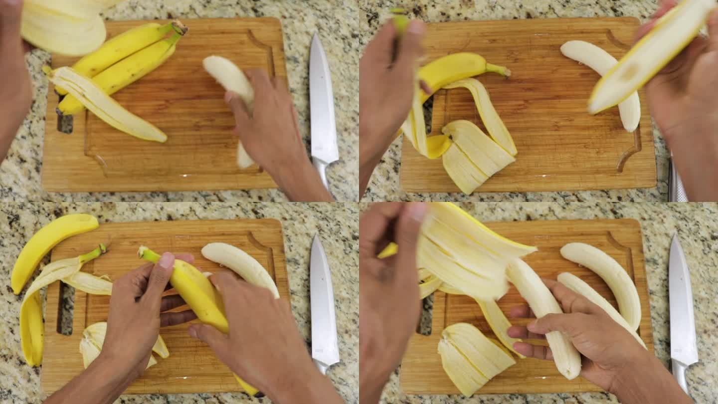 用手剥香蕉，从顶部拍摄