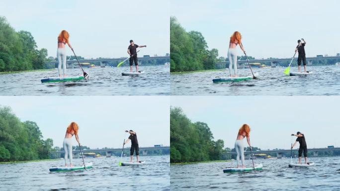 女士和先生在暑假期间在湖上享受水上运动