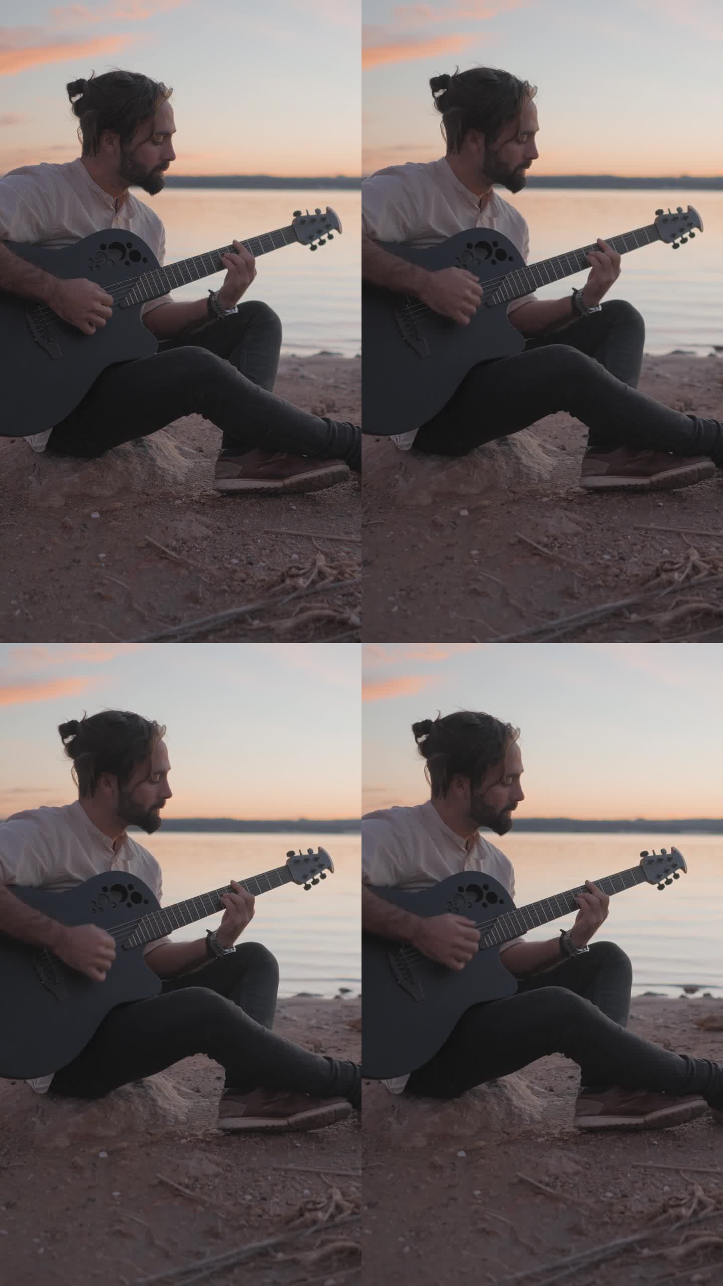 日落时分，在西班牙阿利坎特的托雷维耶哈粉红湖边，一个年轻人在沙滩上拿着吉他弹和弦的剪影