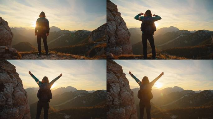 日落时分，拥抱大自然的辉煌:女人陶醉在高山的威严中，她站在山顶，张开双臂，喜悦和胜利