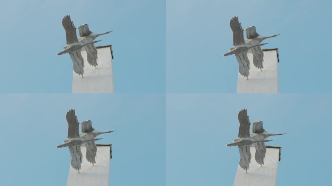 纪念第二次世界大战的雕塑。两只飞鹤。4 k。
