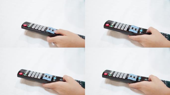 用手按电视遥控器可选择频道。