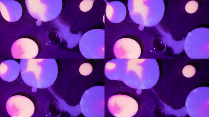 紫色气泡在抽象艺术流体中凝聚。微距镜头