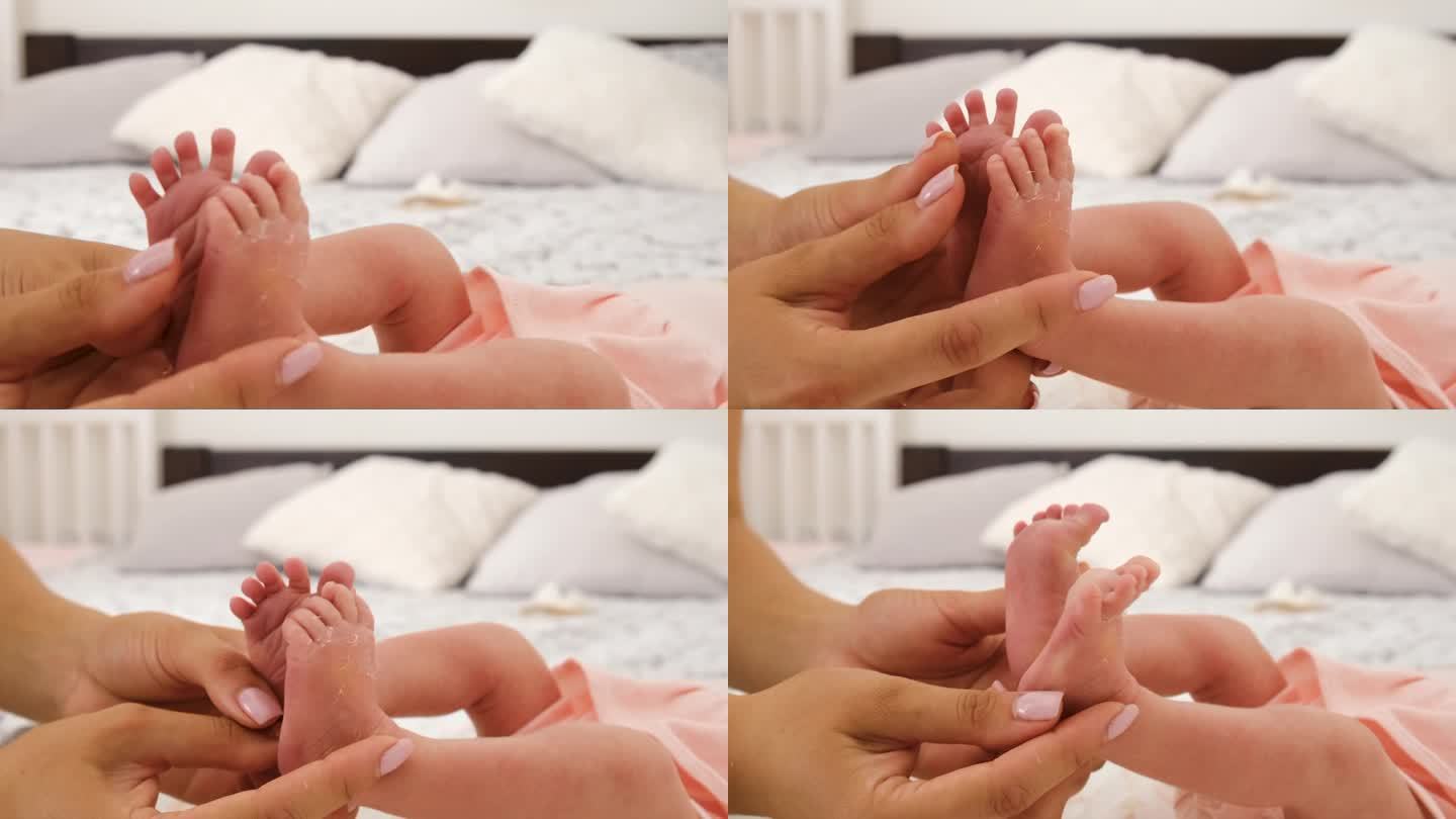 妈妈给婴儿做足部按摩。有选择性的重点。人。