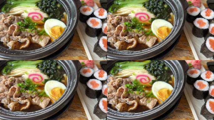 亚洲面条汤，拉面与鸡肉，豆腐，蔬菜和鸡蛋在一个黑色的碗。板岩的背景。前视图。
