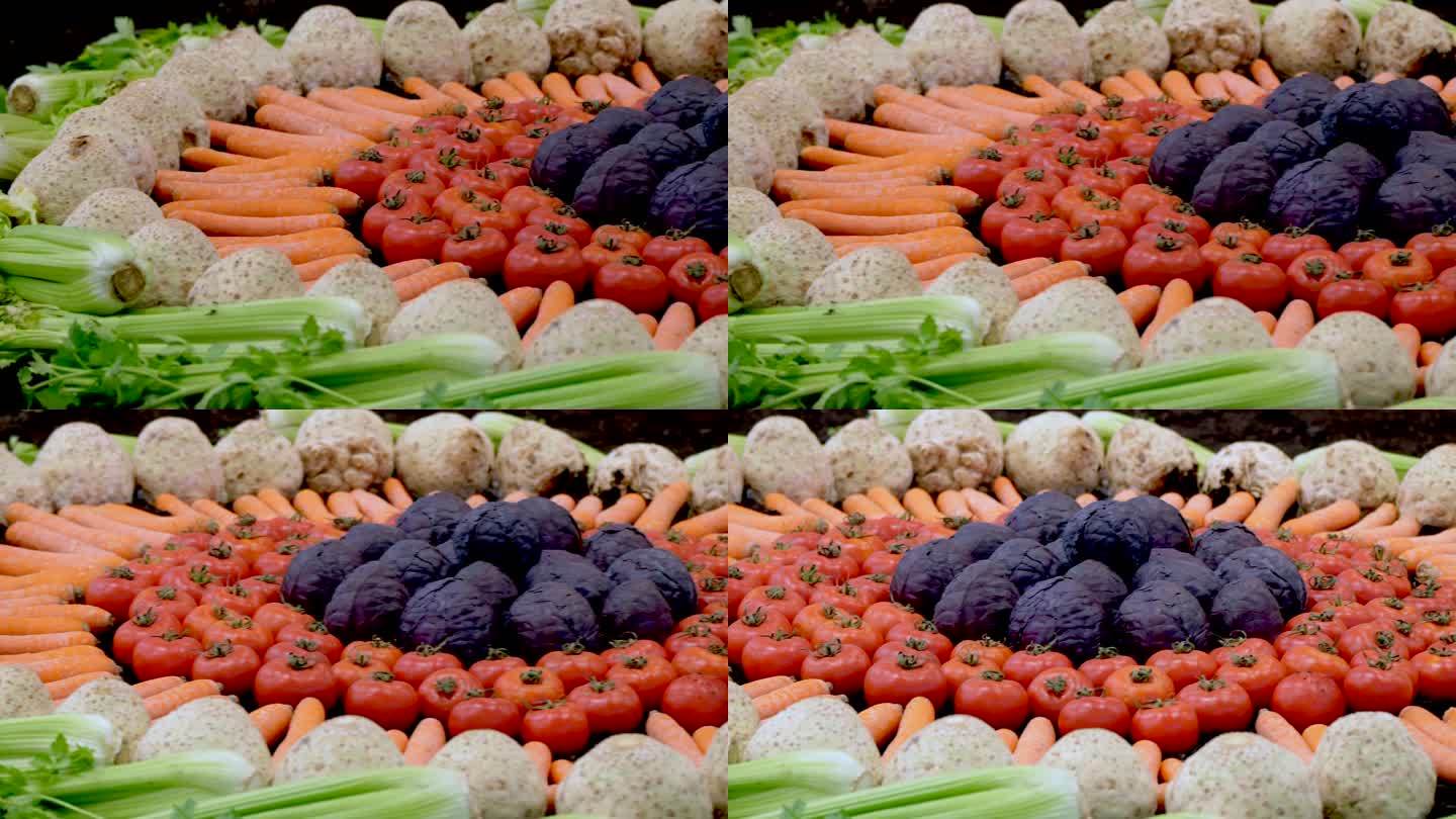 各种成熟的蔬菜在桌子上排成一排形成圆形的特写镜头