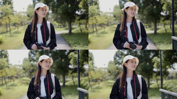 一个开朗的年轻女子微笑着在公园里散步，享受着明媚的春日。