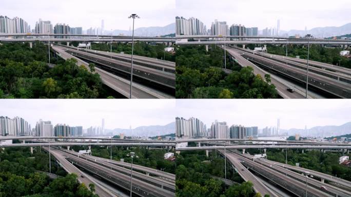 夏日城公路鸟瞰图及通往美丽小镇的汽车路线。亚洲人迁往繁华的商业之都香港。飞越香港十字路口香港4k