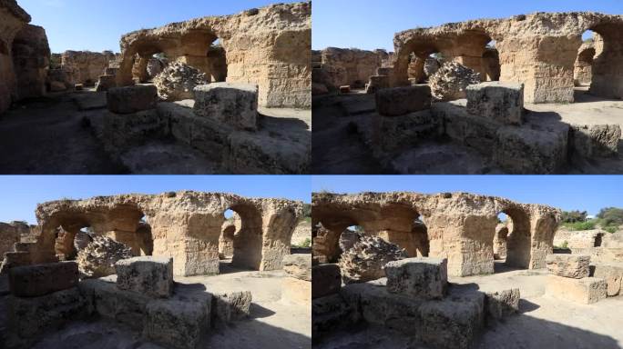 在晴朗的蓝天下，突尼斯迦太基的古罗马遗迹，有拱门和石头