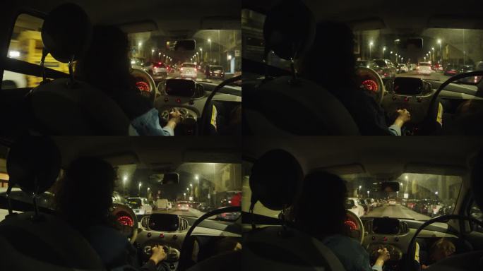 一位母亲晚上在城里开车，她的男婴坐在安全座椅上