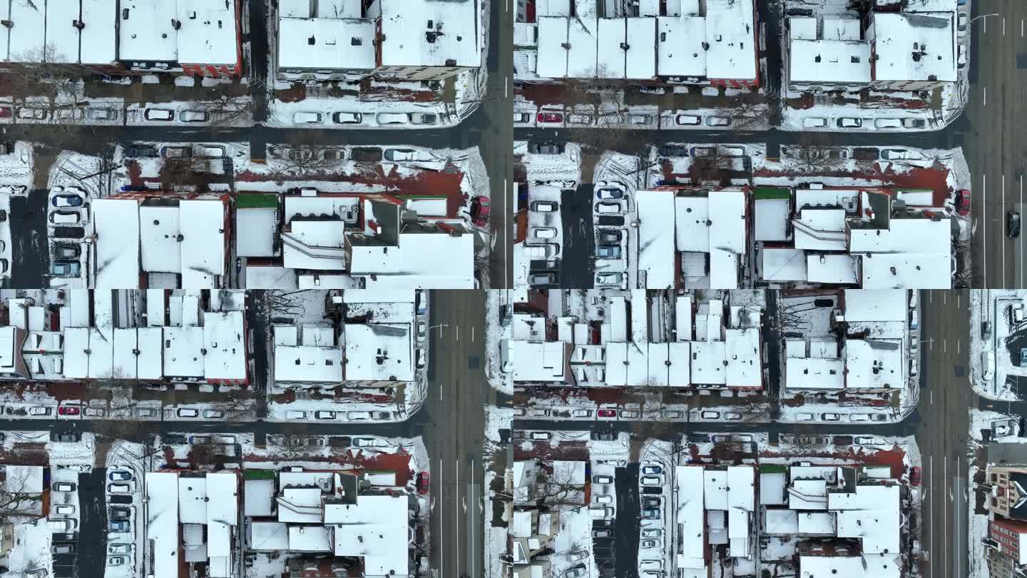 美国东北部的城市街道在暴风雪后的俯视图。联排房屋上空的航拍照片。