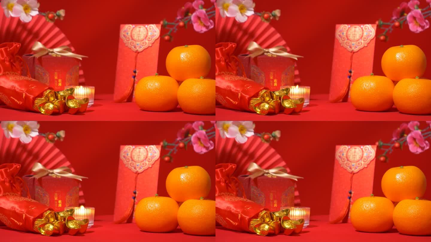 中国农历新年的红色背景环。中国古代金条装丝袋，红包，红包，红包，有文字祝福的红色礼盒，橘子，纸扇，梅