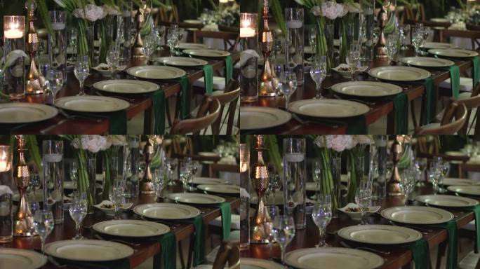 优雅的婚宴桌设计，配有玻璃器皿、盘子和天然花卉。