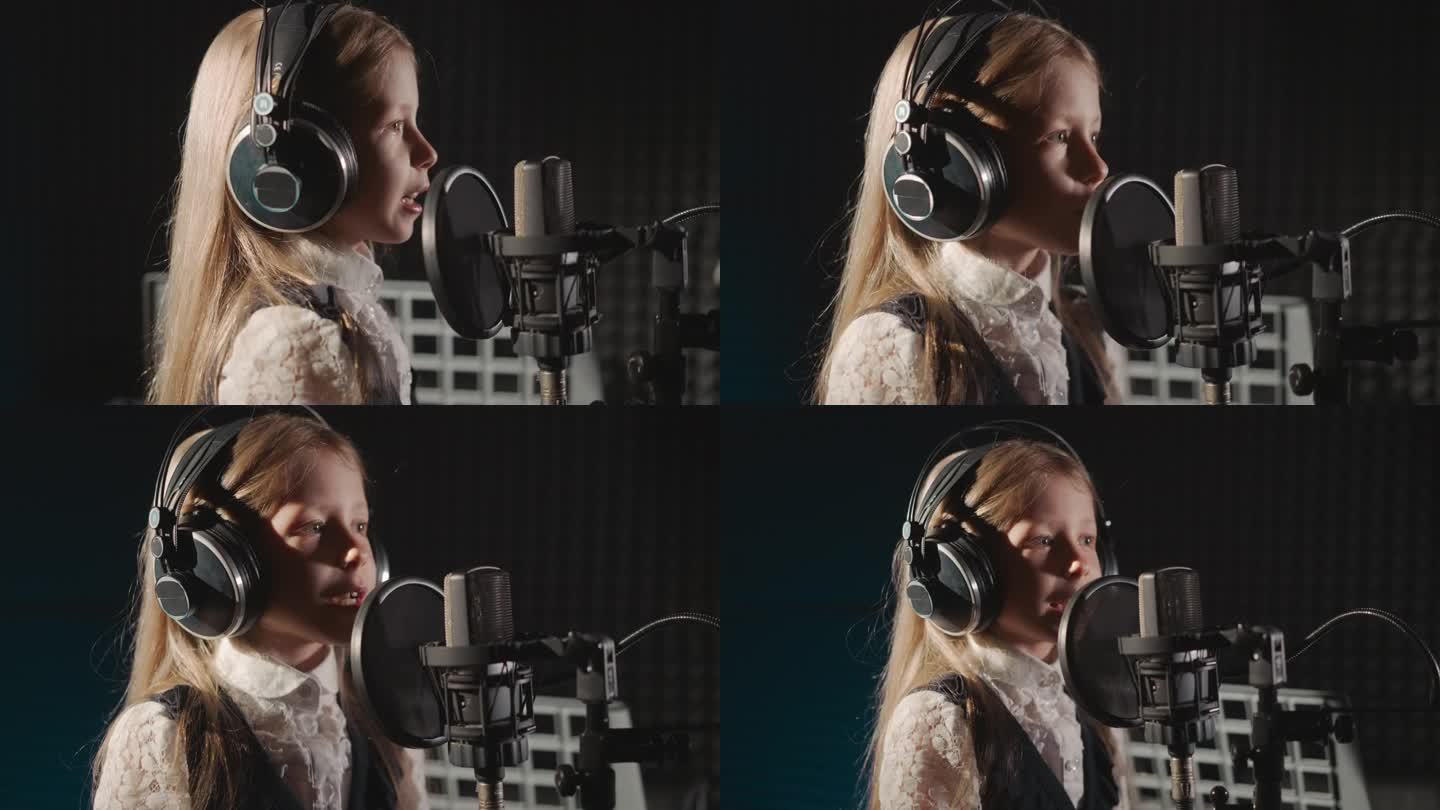 戴耳机的女孩在录音室唱歌