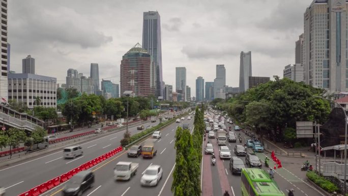 白天雅加达市现代市中心交通街道道路顶部桥梁全景4k延时拍摄印度尼西亚