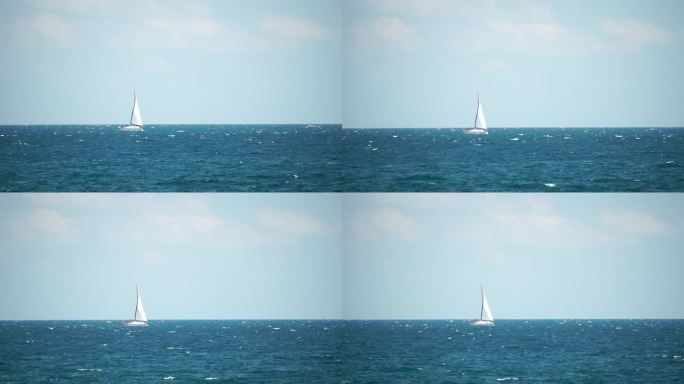 海上的游艇。豪华游轮之旅。深蓝色水面上白色小船的侧视图。鸟瞰富裕的游艇在海上航行。夏季豪华游轮之旅。