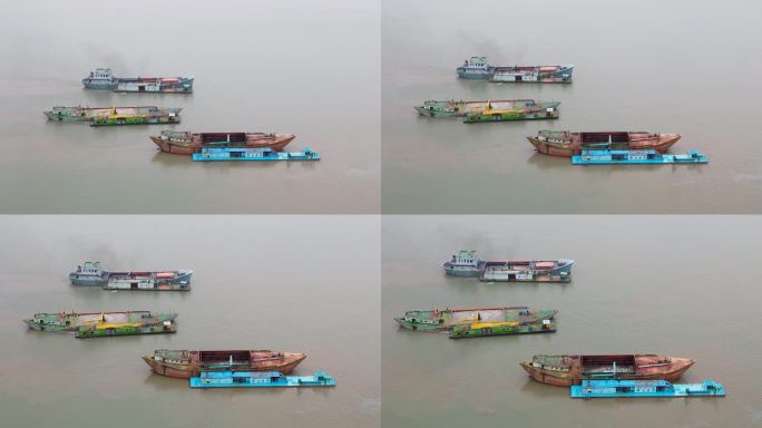 在孟加拉湾，锈迹斑斑的货船正被挖沙船填满