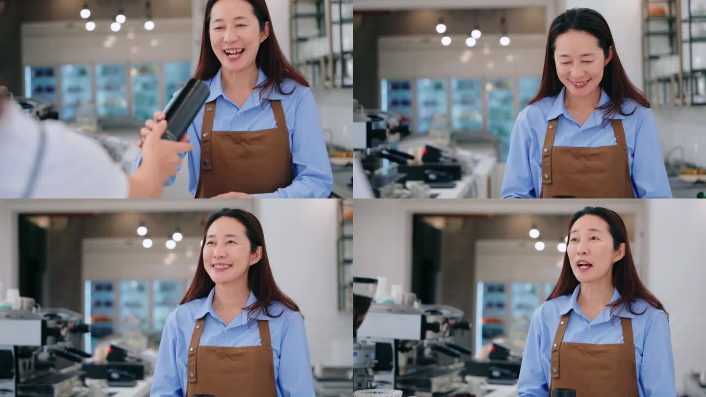 一个微笑的亚洲女服务员在咖啡店里，递给顾客一个热杯子，描绘了热情好客和优质的客户服务。