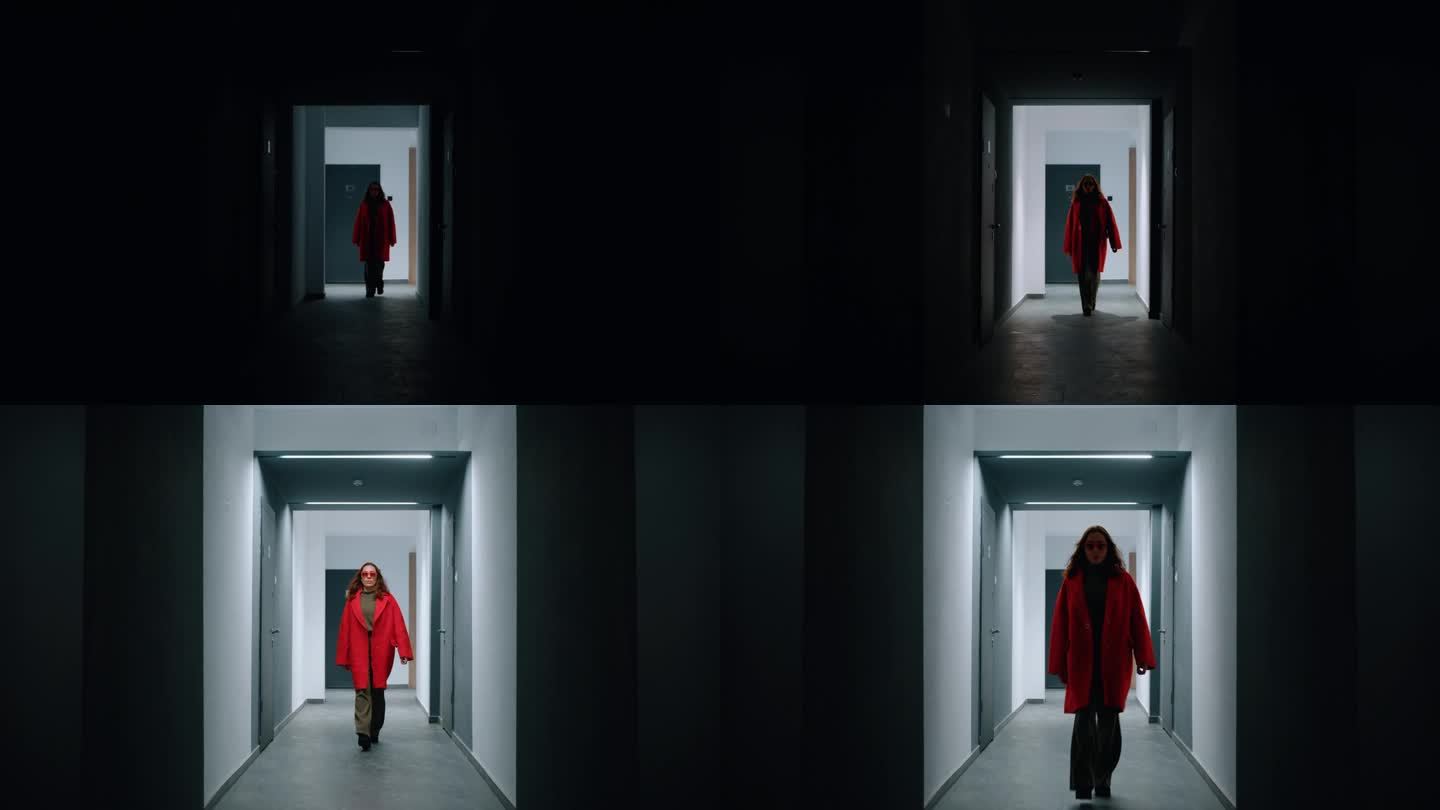 穿红衣服的女人走进走廊，沿着走廊快步走着