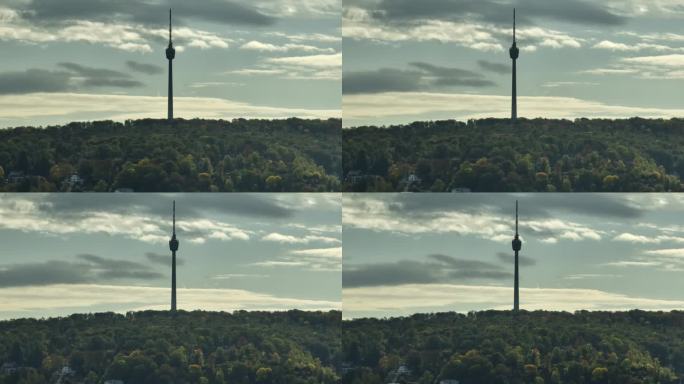 阳光明媚的夜晚，斯图加特市著名的电视广播塔前航拍全景4k德国