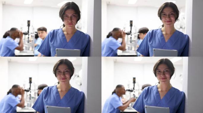 女眼科学生使用数码平板电脑的视频肖像，然后面对镜头微笑