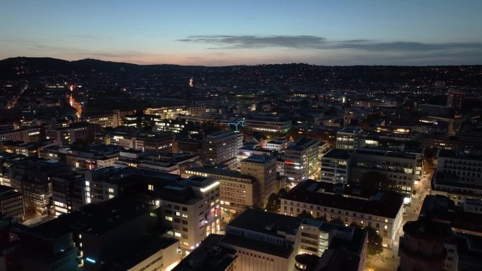 日落天空夜晚照明斯图加特城市现代中心航拍全景4k德国
