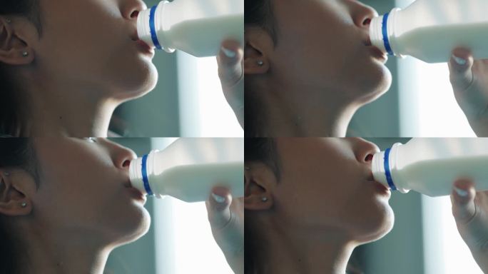 一个女人喝牛奶的特写镜头
