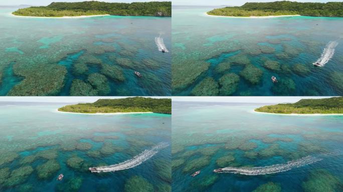 在斐济，一群浮潜者在珊瑚礁周围游泳