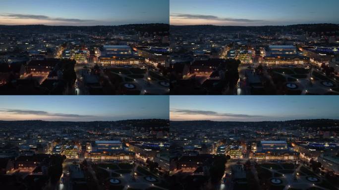 日落时分照明斯图加特市中心广场航拍全景4k德国