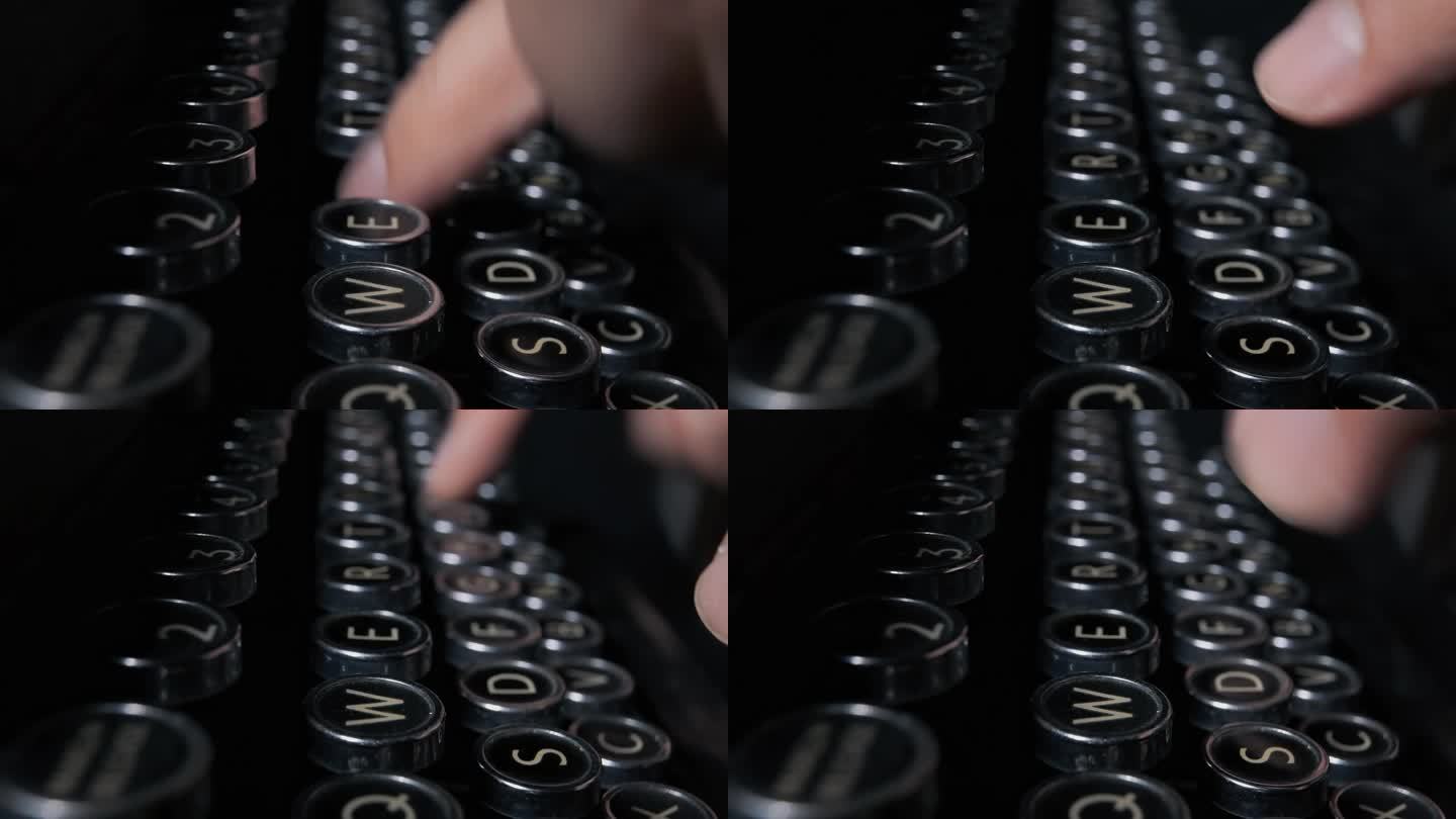 手指正在按下一台20世纪20年代的老式打字机的按键来写文件。唤起侧面细节的特写镜头。