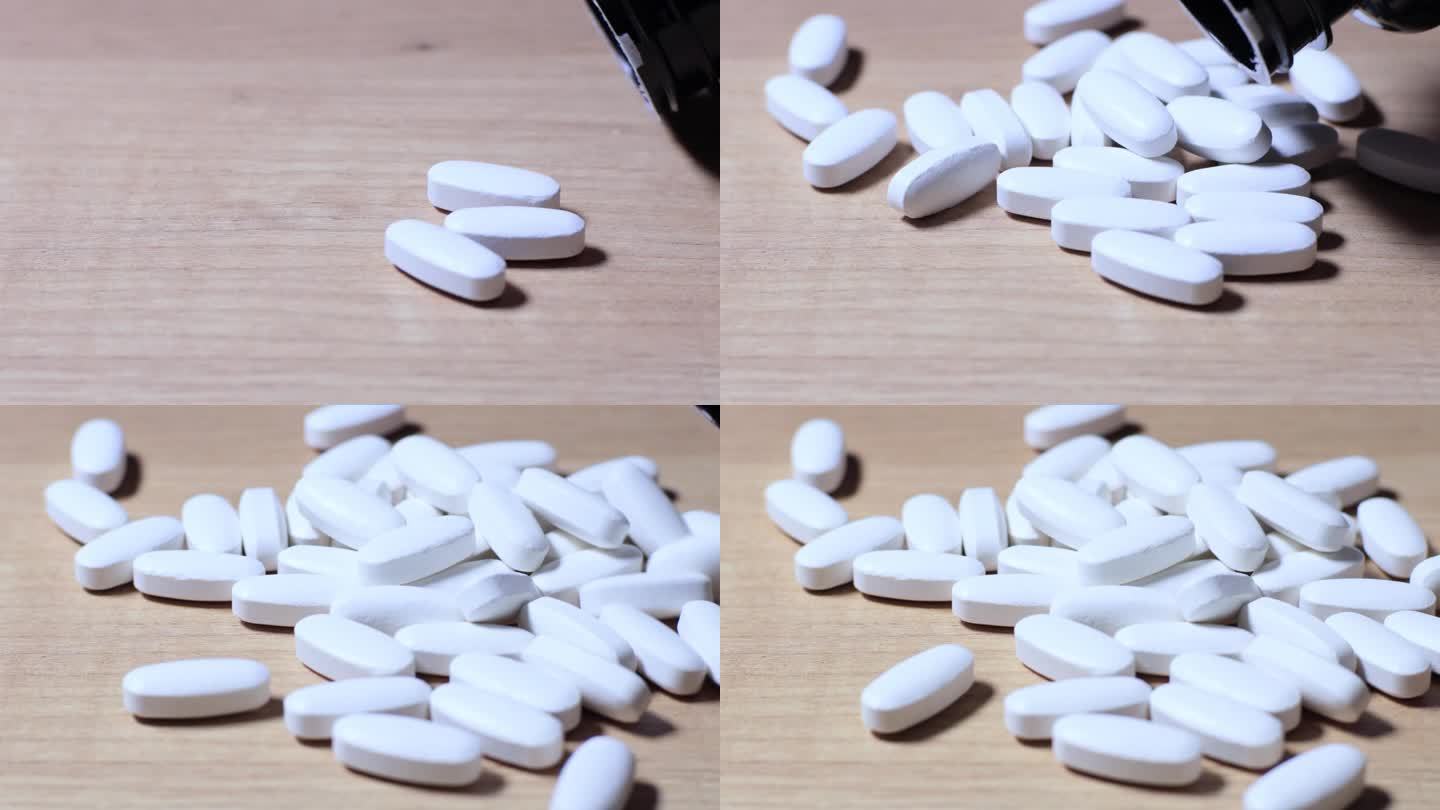 一颗白色胶囊或药片从桌子上的盒子里掉出来的4k慢动作镜头。健康饮食补充剂。用于保健的微量元素和维生素