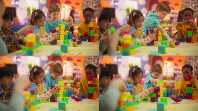 幼儿园小朋友玩五彩积木玩具。美丽的黑人和亚洲女孩和两个快乐的小男孩在现代日托中心一起玩耍