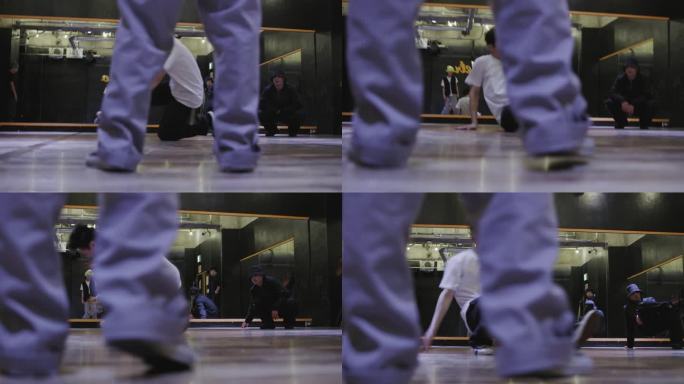 年轻的日本男子在舞蹈工作室跳霹雳舞