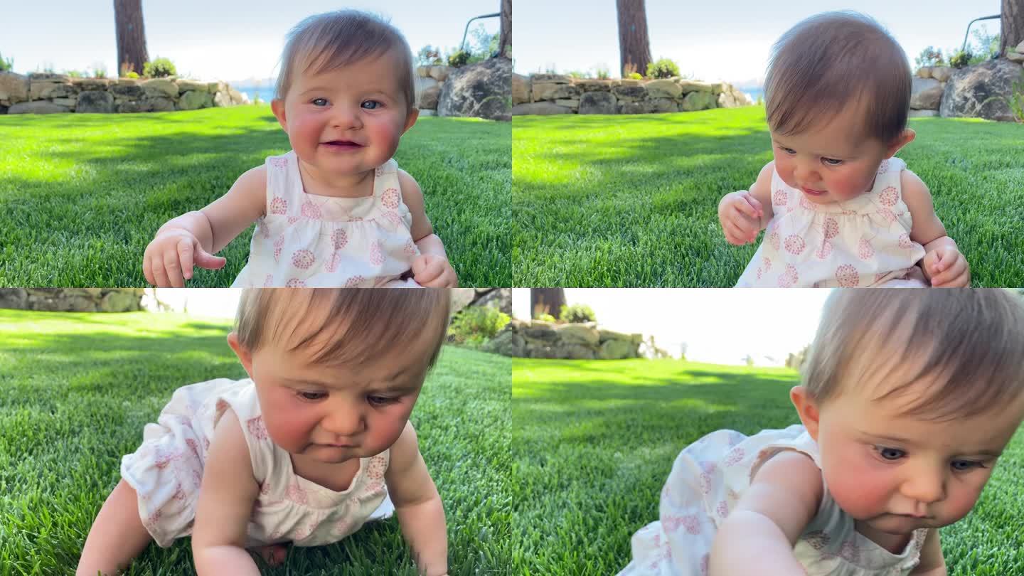女婴第一次学习在草地上爬行