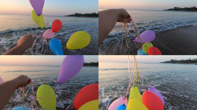 人们在海边的沙滩上玩许多彩色的气球，靠近海浪。五颜六色的小气球用丝带系在沙滩上的海面上。休息、娱乐、