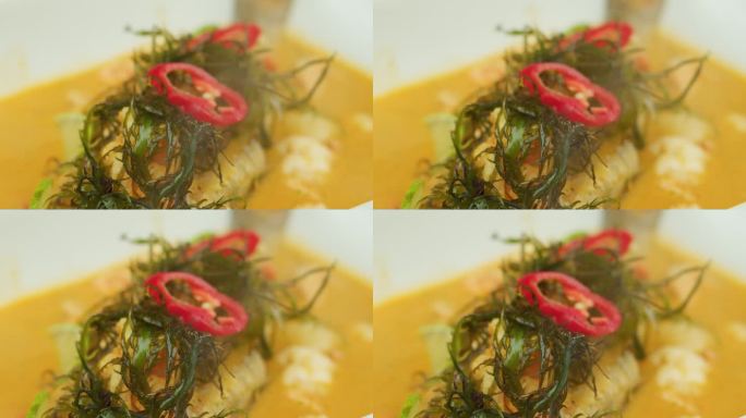 令人惊叹的慢动作和放大镜头的秘鲁菜，鱼优雅地端上一个白色的盘子和烟