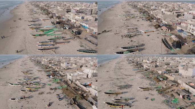 高空飞行。在塞内加尔的圣路易，五颜六色的皮划艇、令人震惊的塑料污染和垃圾躺在海洋的边缘